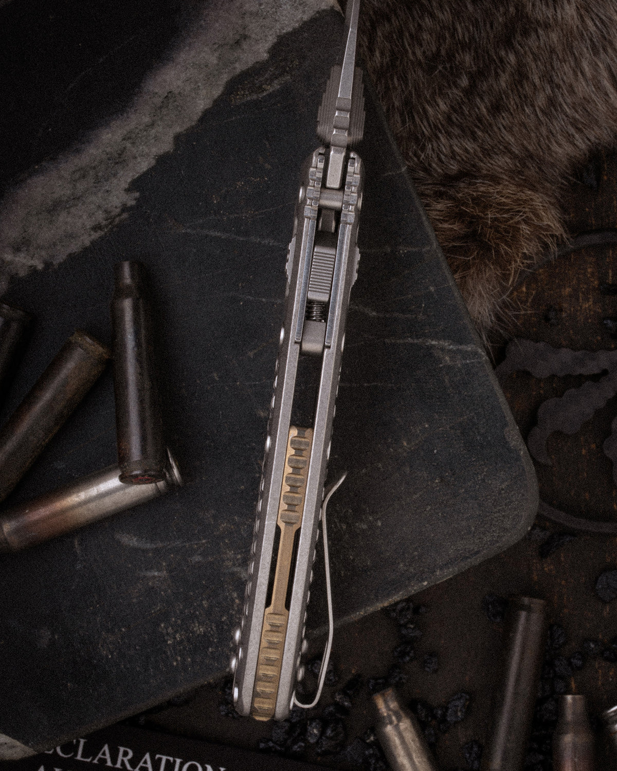 Amphibian® Mini RAM-LOK® MARFIONE SELECT STONEWASH FINISH STONEWASH FINISH FRAG PATTERN TITANIUM WITH BRONZE TITANIUM ACCENT DOUBLE VAPOR BLAST STAINLESS (137MRL-10FRMS1)