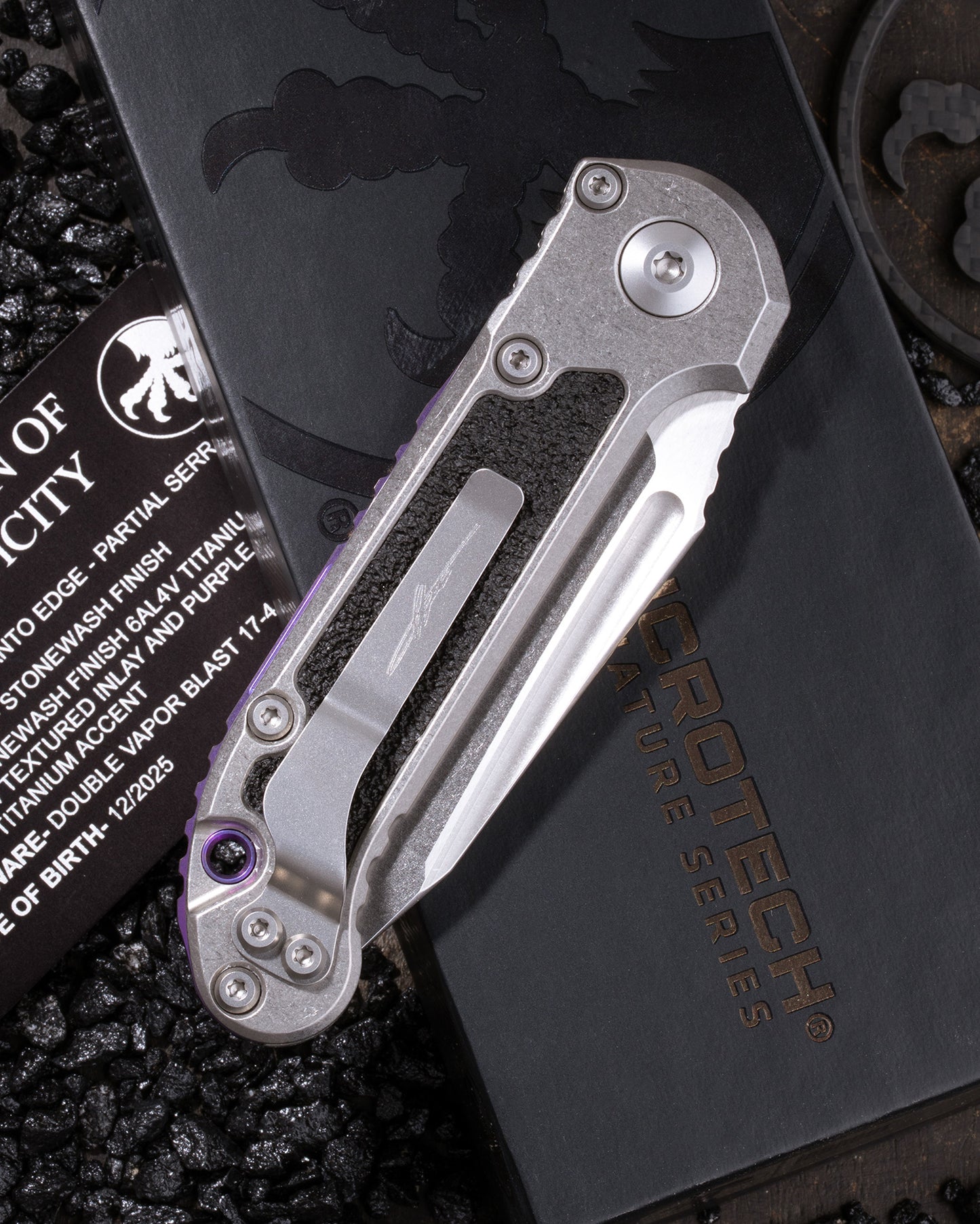 L.U.D.T. – TANTO EDGE PARTIAL SERRATED MARFIONE SELECT STONEWASH FINISH STONEWASH FINISH TITANIUM W/ TEXTURED INLAY AND PURPLE TITANIUM ACCENT DOUBLE VAPOR BLAST STAINLESS