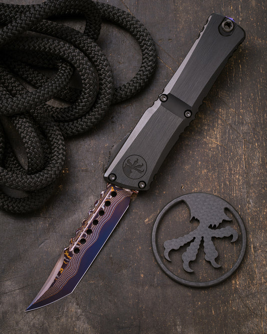 COMBAT TROODON LT – HELLHOUND BLUED BAKER FORGE COPPERMAI DAMASCUS HEFTED ALLOY DLC HARD CUT HARDWARE & PURPLE TITANIUM ACCENT