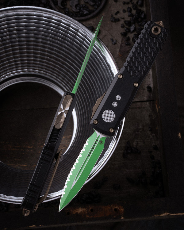 UTX-85® GEN IV D/E FULL SERRATED JEDI MASTER WITH GREEN BLADE, BRONZE HARDWARE, AND BLACK CHASSIS (12324-3JM)