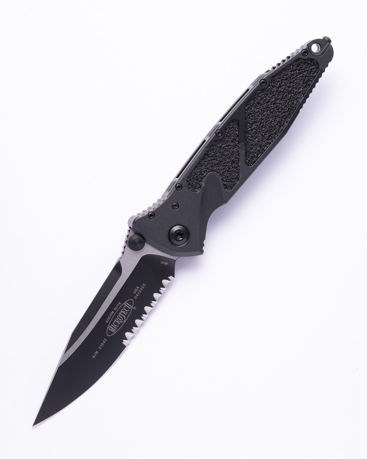 Black folding tactical knife with serrated blade and textured handle on white background