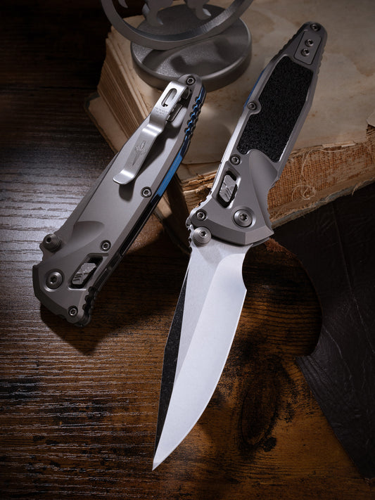 Socom® Elite RAM-LOK™ – Clip Point Cracked Ice Finish Double Vapor Blast Titanium w/ Textured Inlay & Blue Ti Accent Double Vapor Blast Stainless Prototype