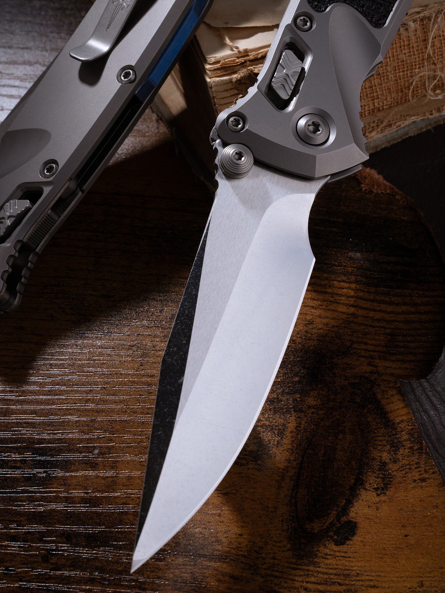 Socom® Elite RAM-LOK™ – Clip Point Cracked Ice Finish Double Vapor Blast Titanium w/ Textured Inlay & Blue Ti Accent Double Vapor Blast Stainless Prototype