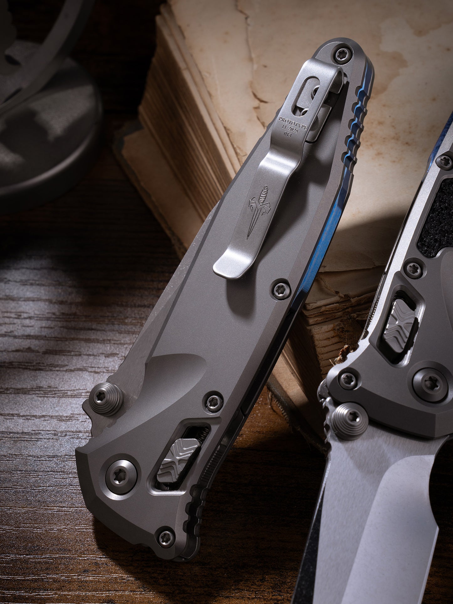 Socom® Elite RAM-LOK™ – Clip Point Cracked Ice Finish Double Vapor Blast Titanium w/ Textured Inlay & Blue Ti Accent Double Vapor Blast Stainless Prototype