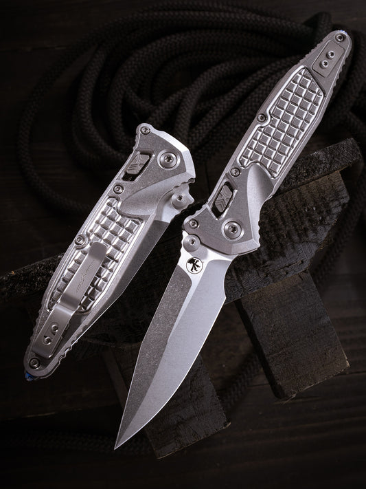 Socom® Elite RAM-LOK™ – Spear Point Marfione Select Stonewash Finish Frag Pattern Titanium W/ Blue Titanium Accent Double Vapor Blast Stainless