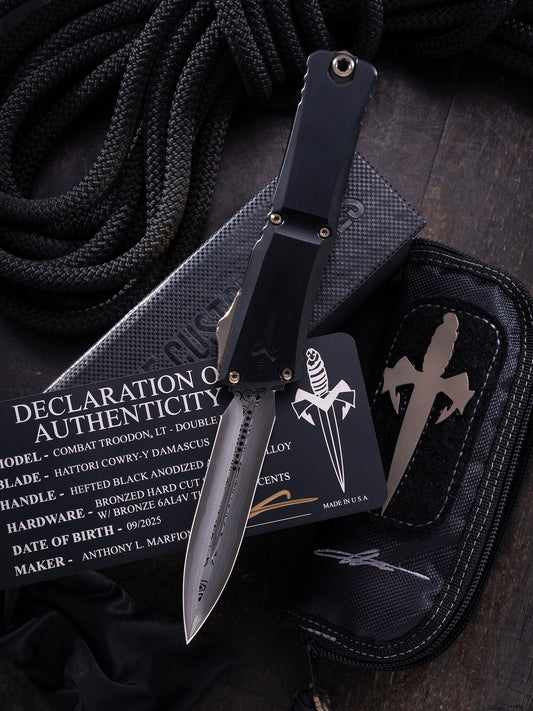 COMBAT TROODON LT – DOUBLE EDGE HATTORI COWRY-Y DAMASCUS HEFTED BLACK ANODIZED ALLOY BRONZED HARD CUT STAINLESS W/BRONZE TITANIUM ACCENTS