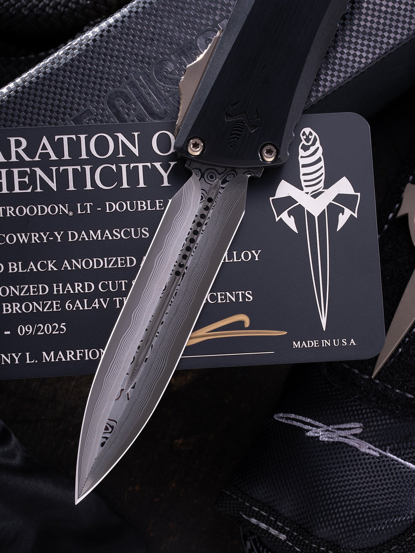 COMBAT TROODON LT – DOUBLE EDGE HATTORI COWRY-Y DAMASCUS HEFTED BLACK ANODIZED ALLOY BRONZED HARD CUT STAINLESS W/BRONZE TITANIUM ACCENTS